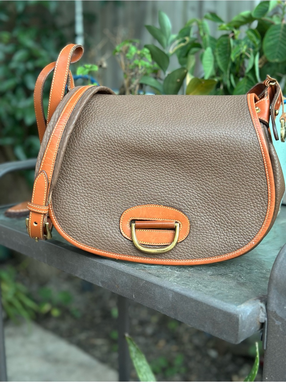 Dooney & Bourke Brown Pebbled Leather Horseshoe Crossbody with Tan Trim